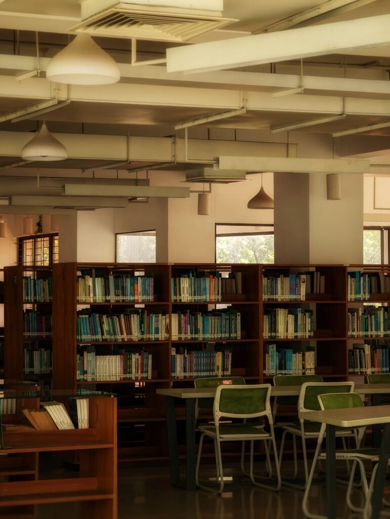 Cozy library with wooden bookshelves and reading tables